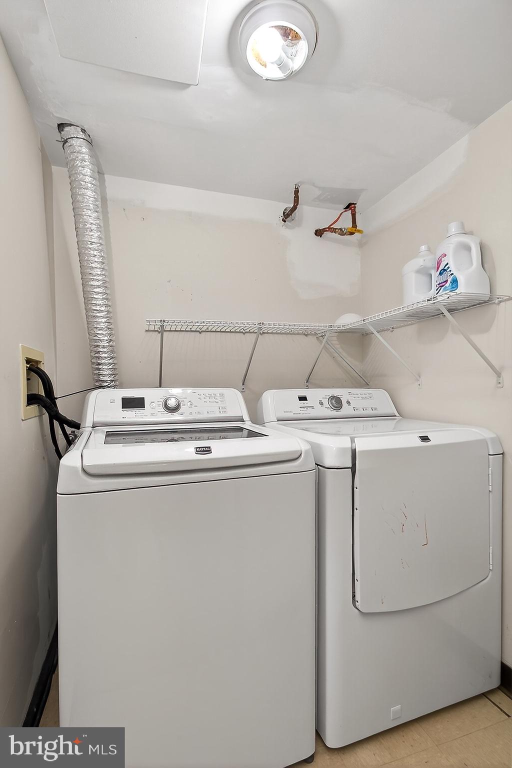 5920 Cove Landing Road, Unit 102 Burke, VA 22015 - Photo 19 of 45 a utility room with dryer and washer