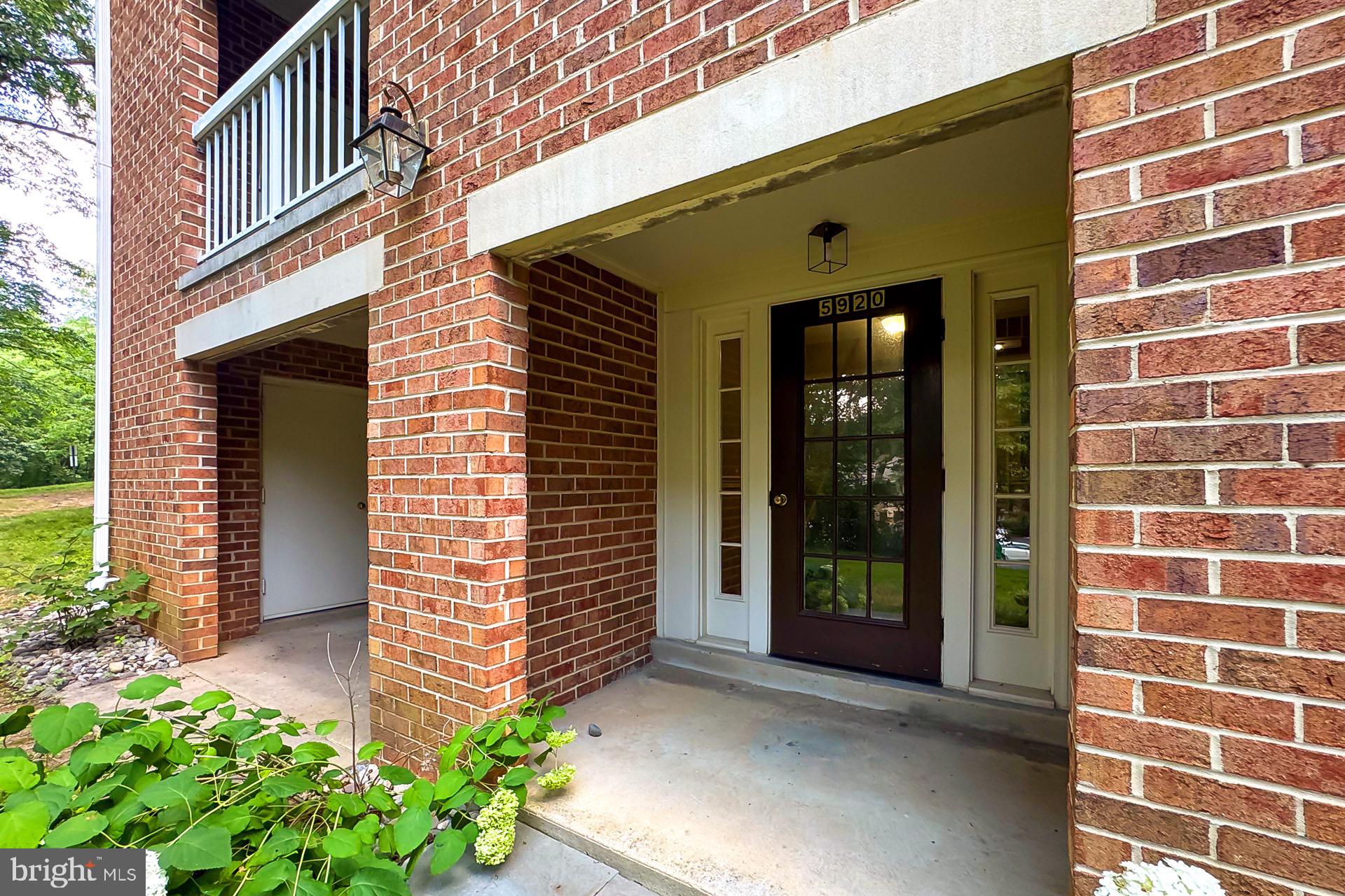 5920 Cove Landing Road, Unit 102 Burke, VA 22015 - Photo 26 of 45 a front view of a building with garden