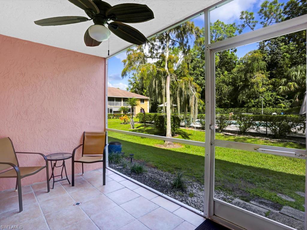 5675 Whitaker Road, Unit B102 Naples, FL 34112 - Photo 3 of 22 a view of a porch with a backyard