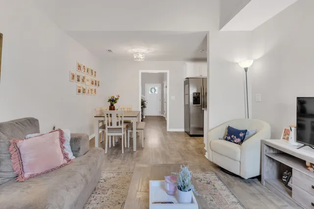 a living room with furniture and a table
