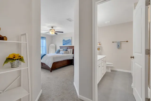 a bedroom with a bed and a couch