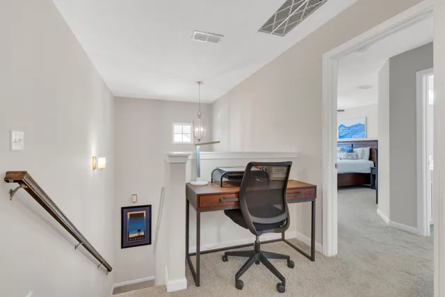 a view of a workspace with furniture