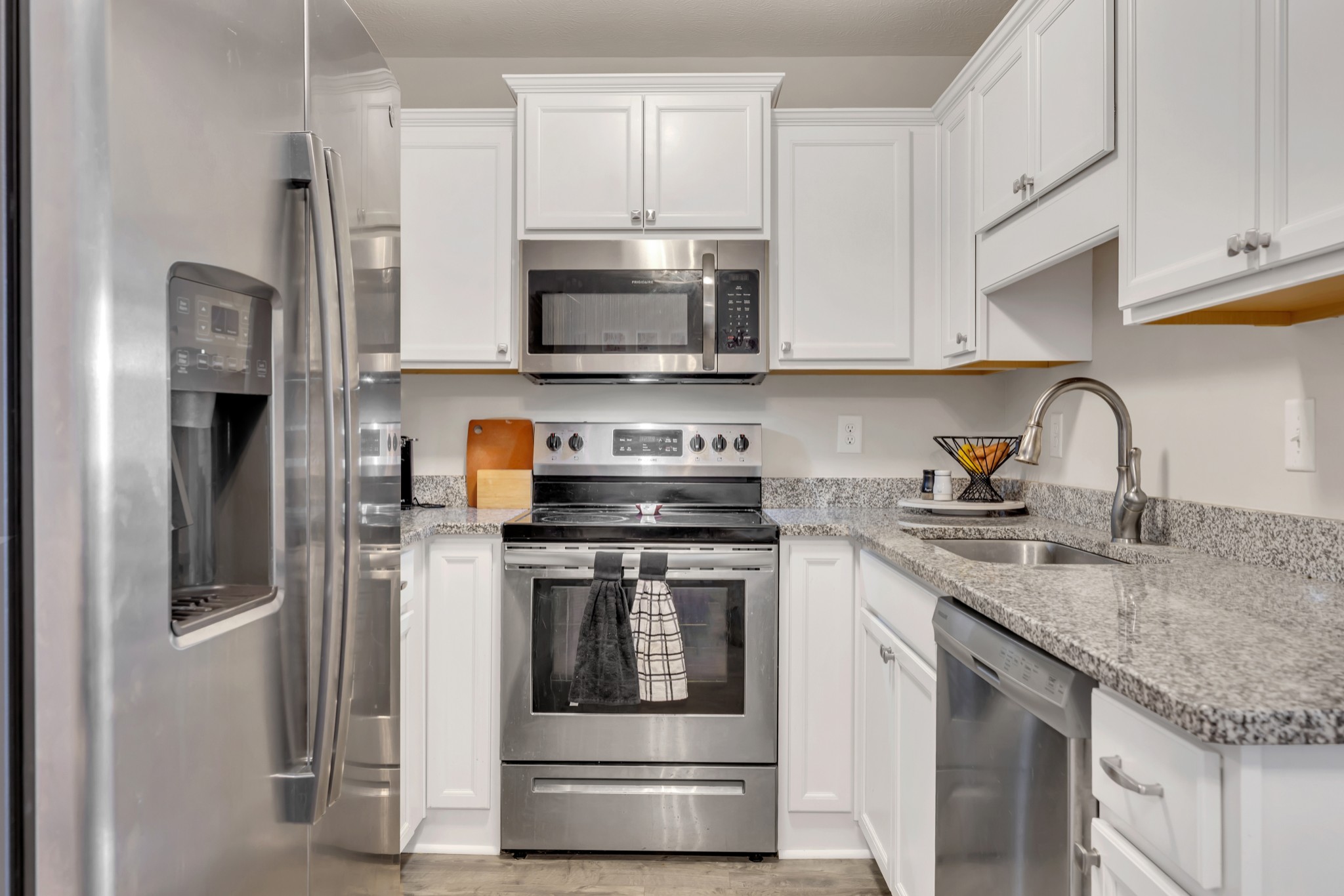 3507 Learning Lane Murfreesboro, TN 37128 - Photo 10 of 30 a kitchen with stainless steel appliances granite countertop a refrigerator a stove a sink and white cabinets