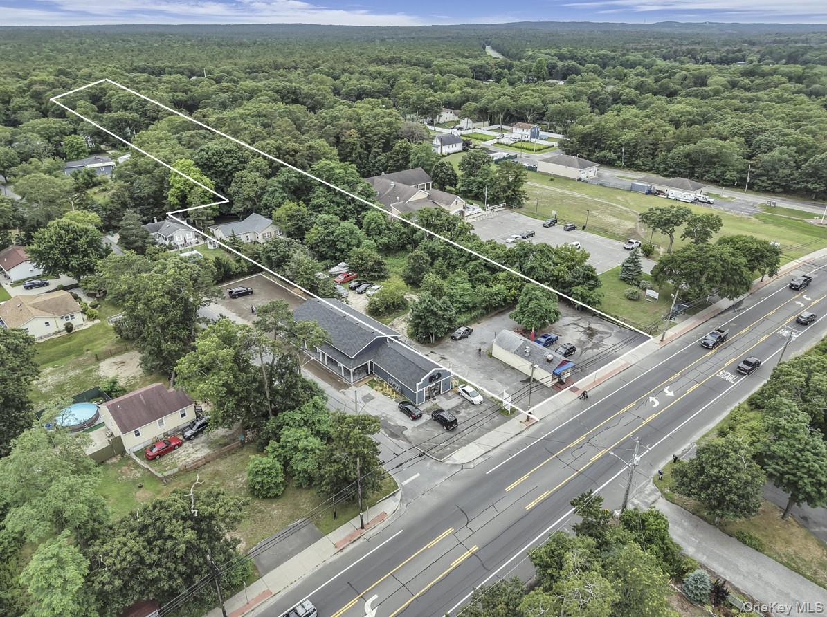 669 Flanders Road Flanders, NY 11901 - Photo 1 of 15 an aerial view of residential houses with outdoor space and street view