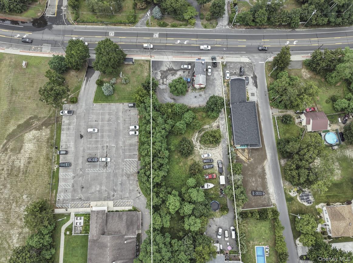 669 Flanders Road Flanders, NY 11901 - Photo 12 of 15 an aerial view of a house with a yard and plants