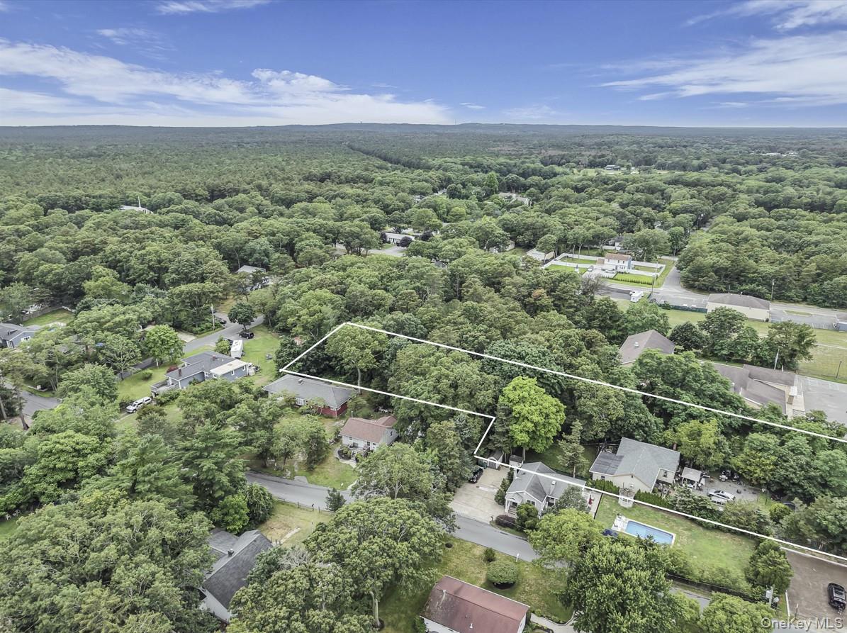 669 Flanders Road Flanders, NY 11901 - Photo 15 of 15 an aerial view of a houses with a yard