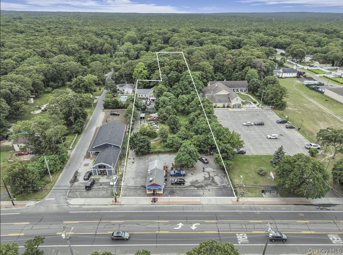 669 Flanders Road Flanders, NY 11901 - Photo 2 of 16 an aerial view of residential houses with outdoor space and street view