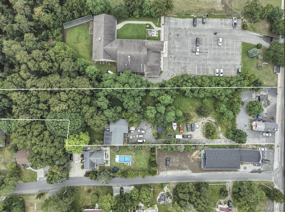 669 Flanders Road Flanders, NY 11901 - Photo 7 of 16 an aerial view of a house with a lake view