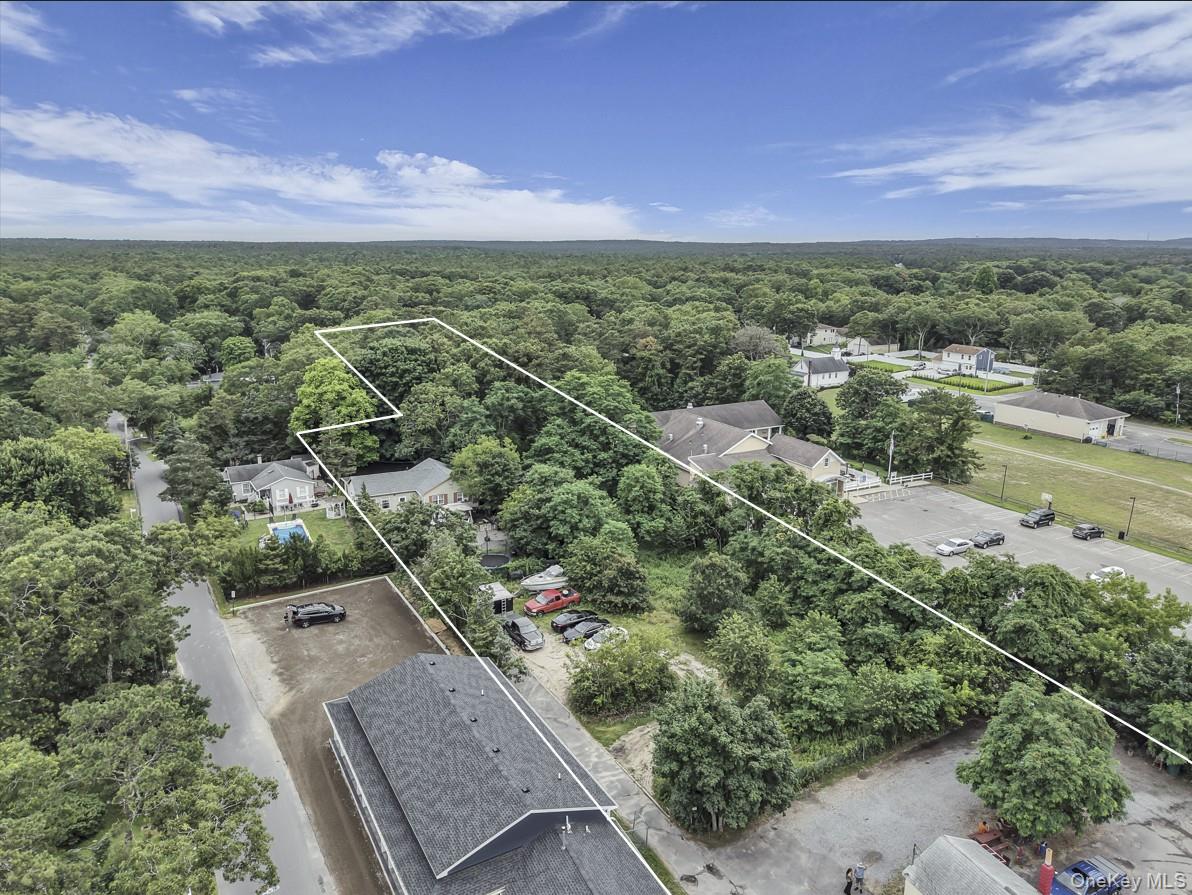 669 Flanders Road Flanders, NY 11901 - Photo 8 of 15 an aerial view of residential houses with outdoor space and trees