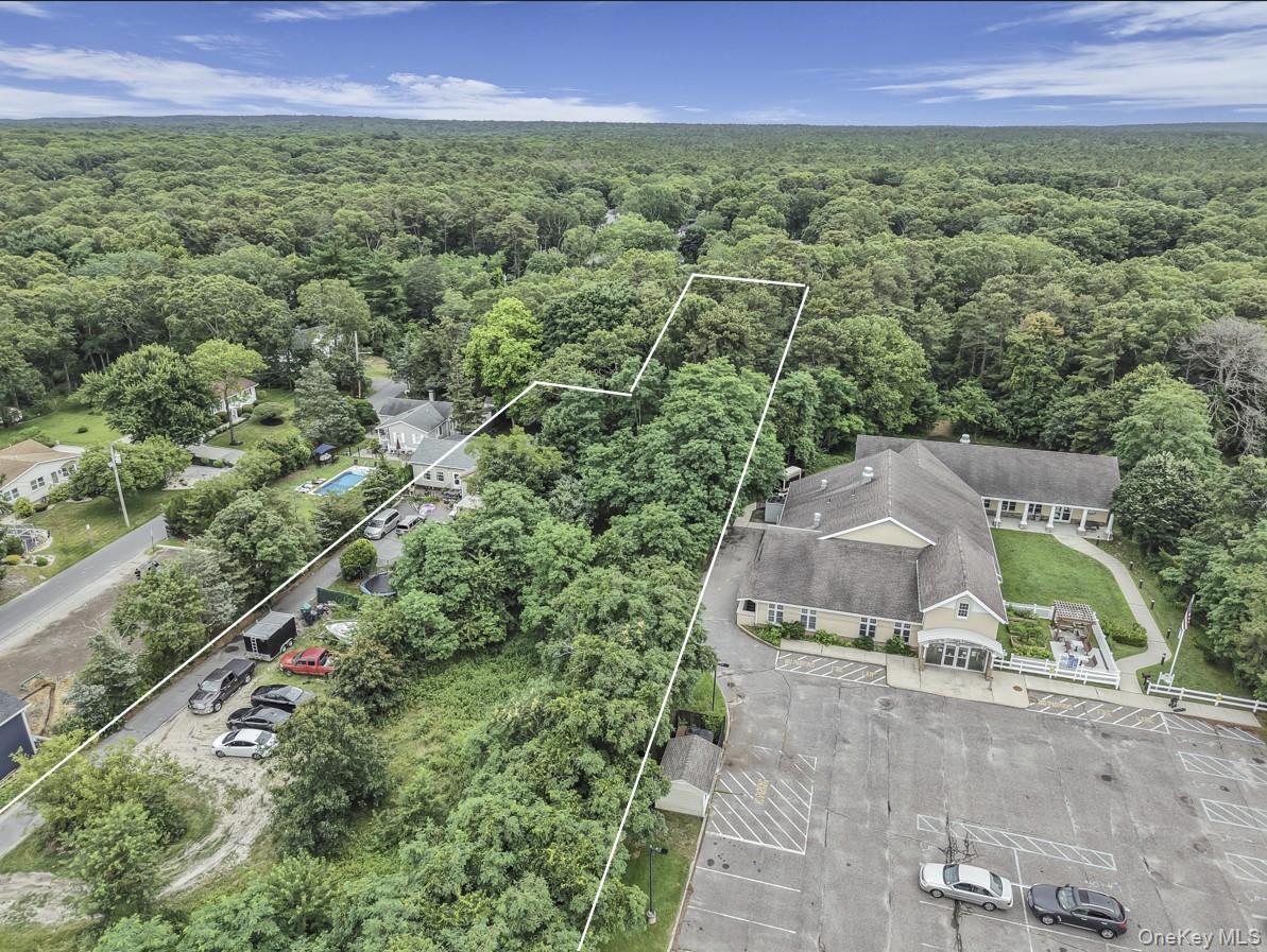 669 Flanders Road Flanders, NY 11901 - Photo 8 of 16 an aerial view of a house with a yard