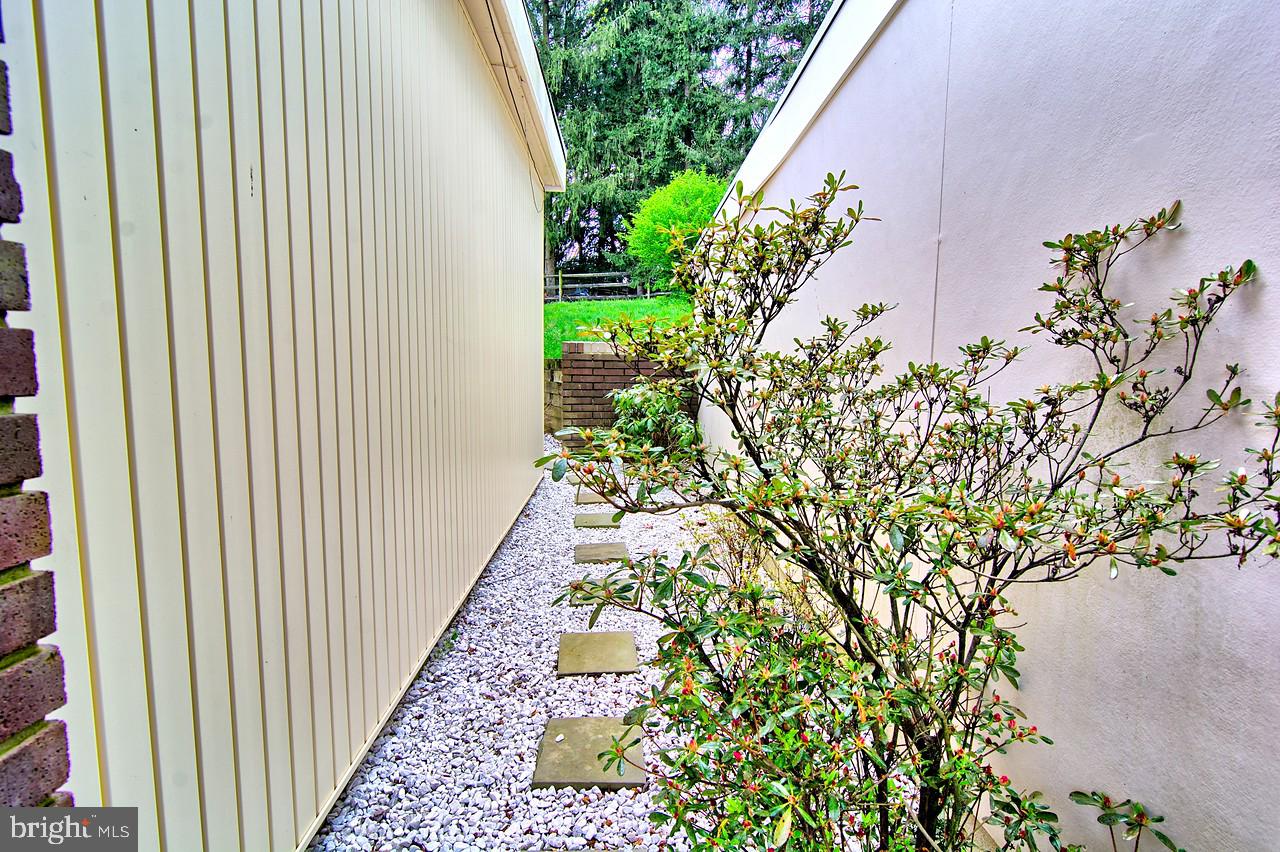 3403 Birch Hollow Road Baltimore, MD 21208 - Photo 39 of 39 Walkway between the house and storage at carport.