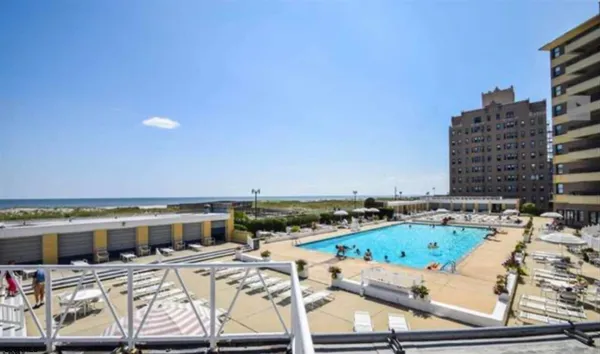 a view of a patio with swimming pool