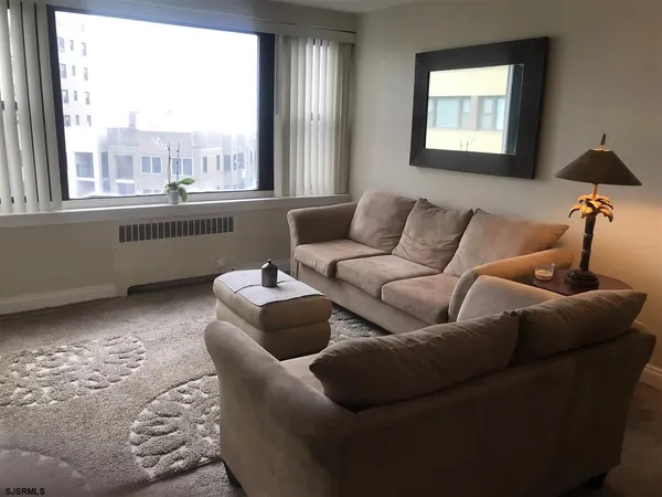 a living room with furniture and a window