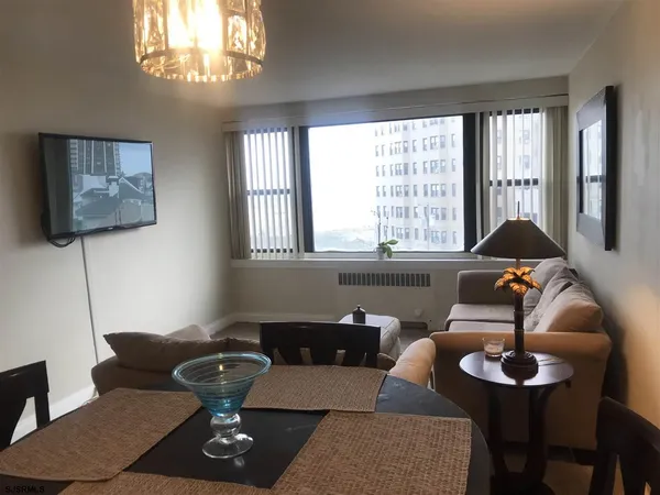 a living room with furniture and a window