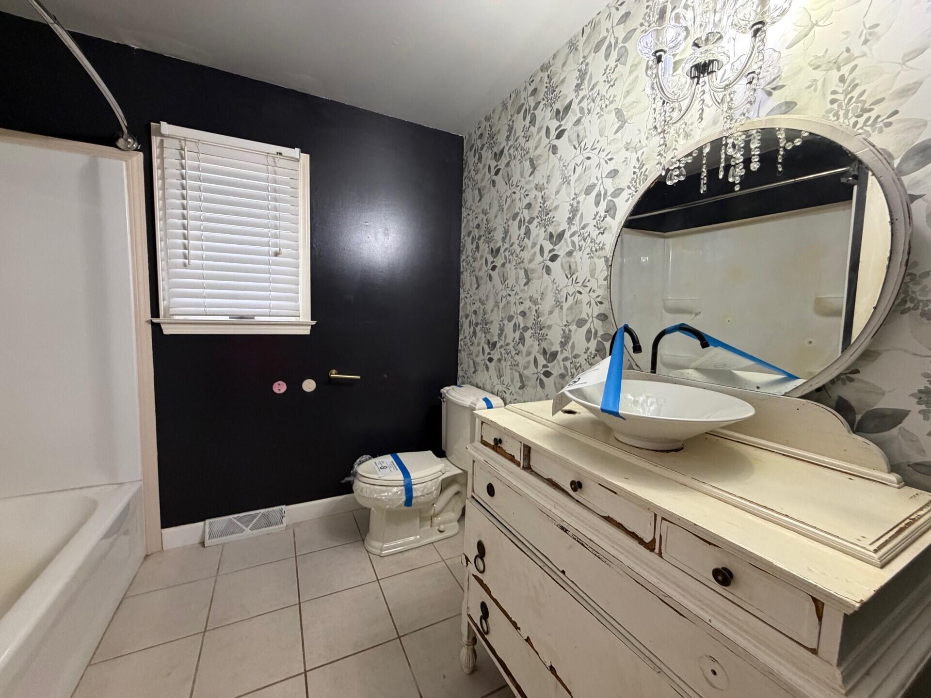 10859 Bunker Drive Demotte, IN 46310 - Photo 15 of 28 a bathroom with a sink and a mirror