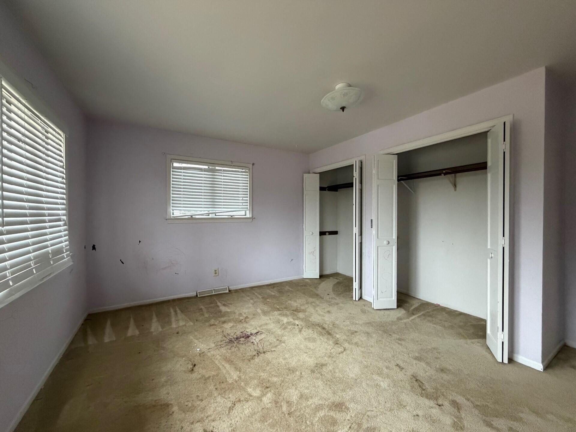 10859 Bunker Drive Demotte, IN 46310 - Photo 21 of 28 an empty room with windows and closet