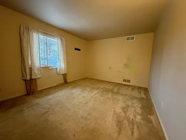 an empty room with windows