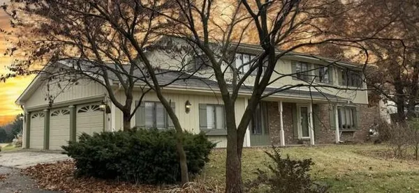front view of a house with a garden