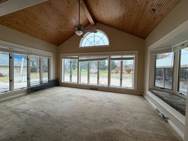 a view of an empty room with a window