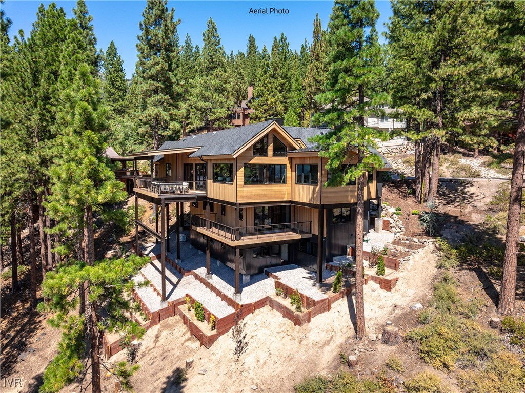 539 Cole Circle Incline Village, NV 89451 - Photo 2 of 49 a front view of a house with a wooden deck and a forest