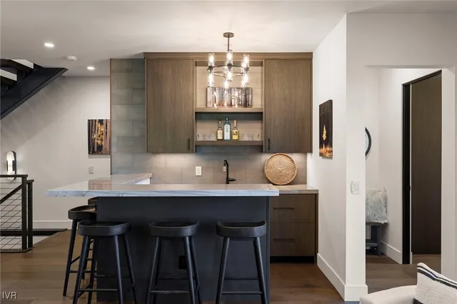 a kitchen with a sink a counter and cabinets