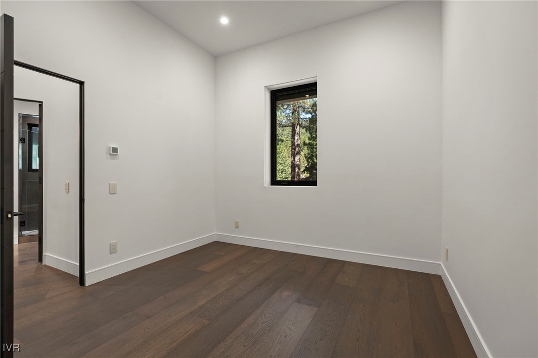 539 Cole Circle Incline Village, NV 89451 - Photo 45 of 49 an empty room with a window and wooden floor