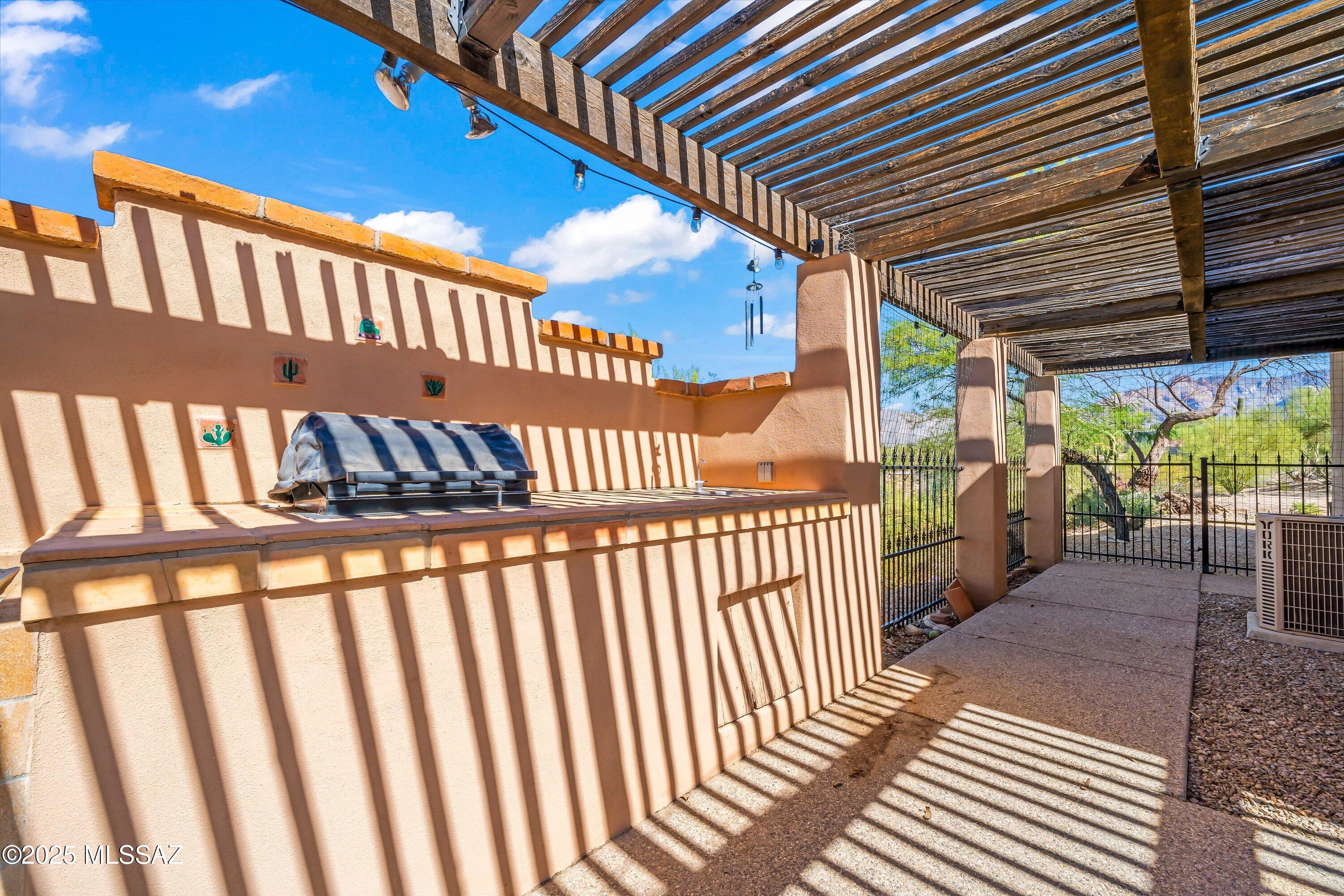 30 West Stone Loop Tucson, AZ 85704 - Photo 25 of 26 a view of a porch with wooden floor