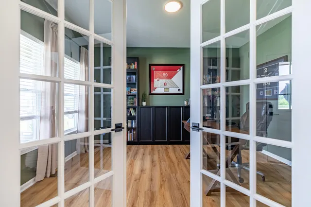a bathroom with a toilet and a mirror