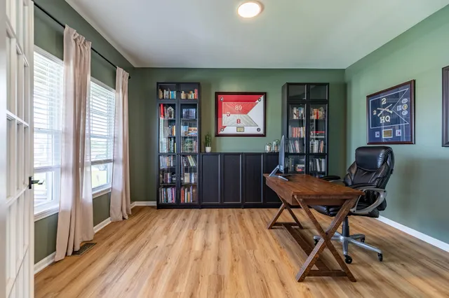 a living room with furniture and stairs