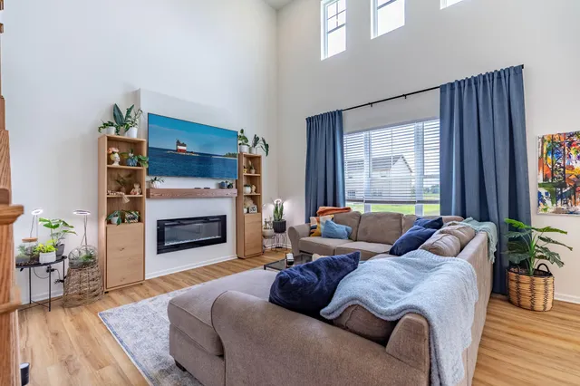 a dining room with furniture and wooden floor