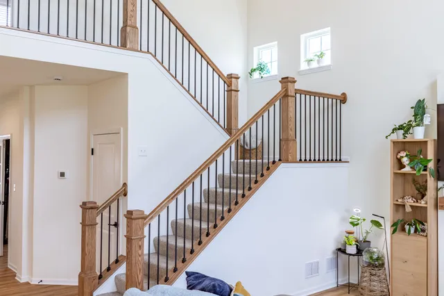 a kitchen with stainless steel appliances granite countertop a stove top oven a sink a stove a refrigerator and cabinets