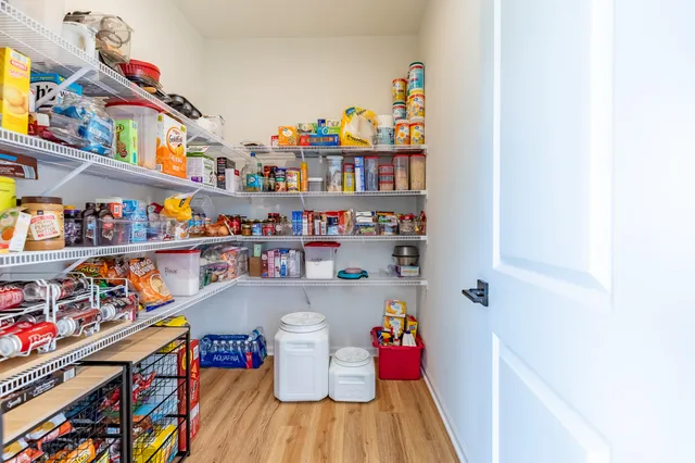 a bathroom with a sink mirror vanity and toilet