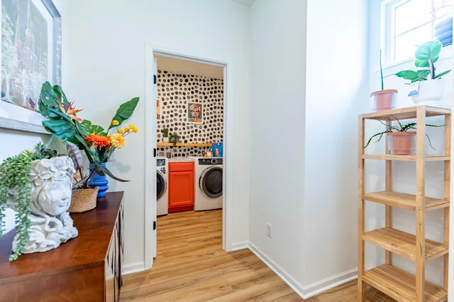 a view of walk in closet with clothes