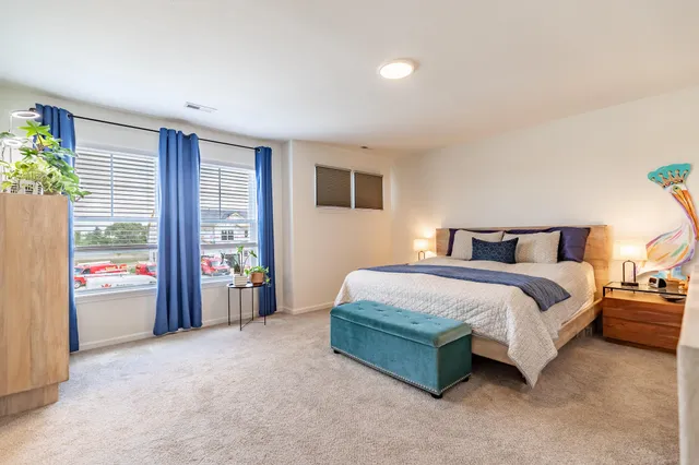 a bathroom with a sink vanity mirror and toilet