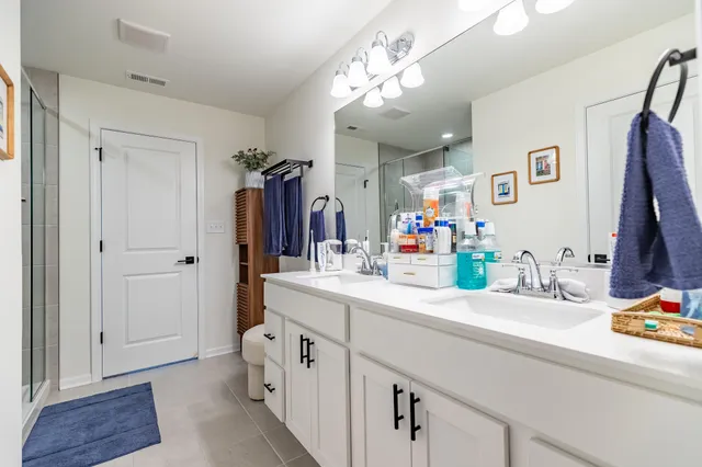 an aerial view of a house with outdoor space lake view and mountain view