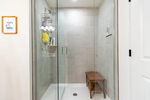 an aerial view of a house with a garden and lake view