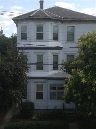 a view of house with yard