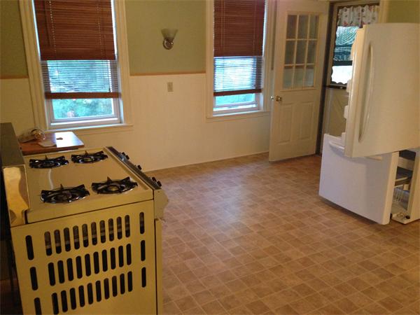 7 Ekman Street Worcester, MA 01607 - Photo 3 of 11 a kitchen that has a stove and a window