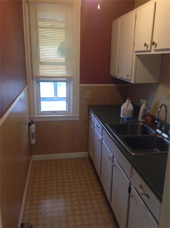 7 Ekman Street Worcester, MA 01607 - Photo 5 of 11 a kitchen with a sink and cabinets