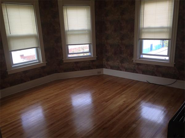7 Ekman Street Worcester, MA 01607 - Photo 7 of 11 an empty room with wooden floor and windows