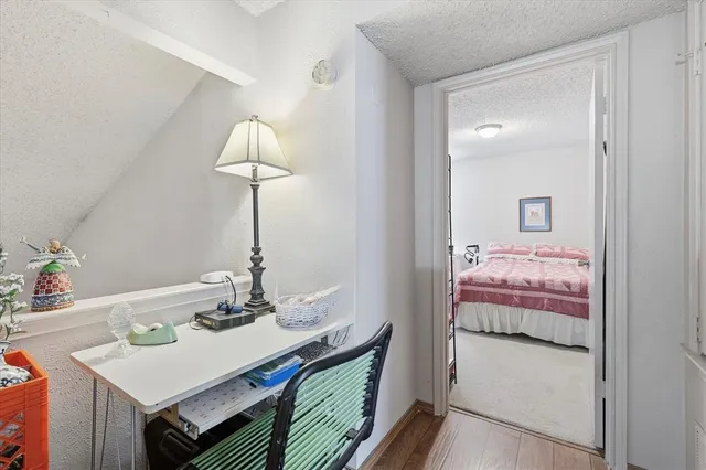 a bedroom with a bed and a table