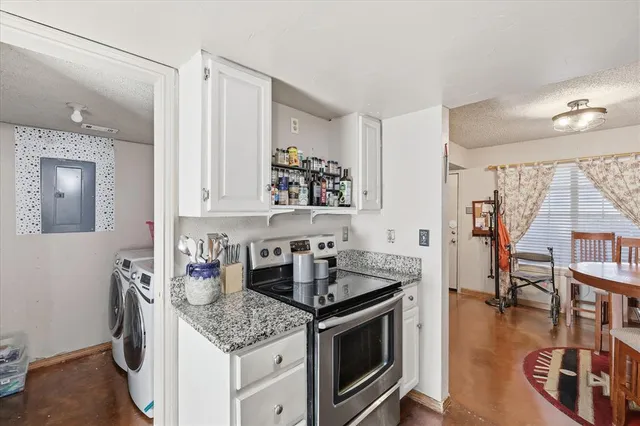 a kitchen with a stove and cabinets