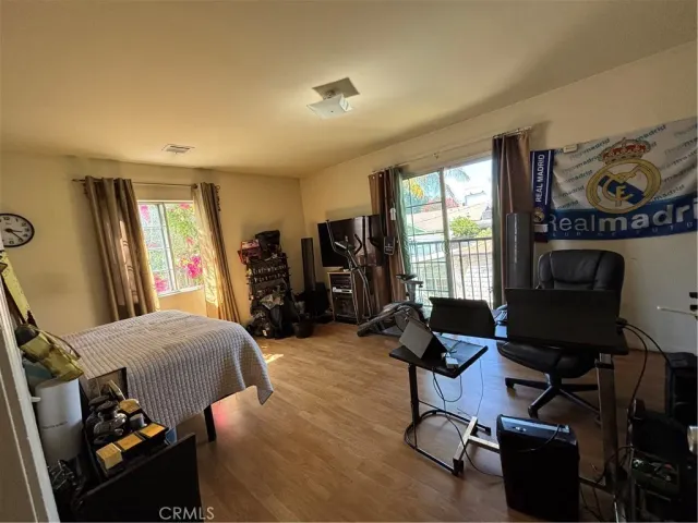 a room with furniture and musical instruments