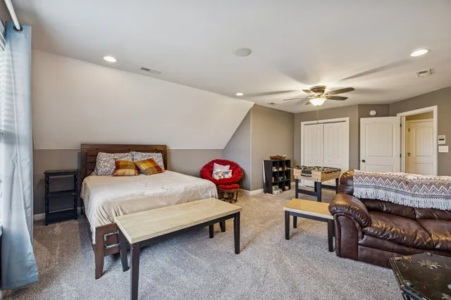 a living room with furniture and white walls