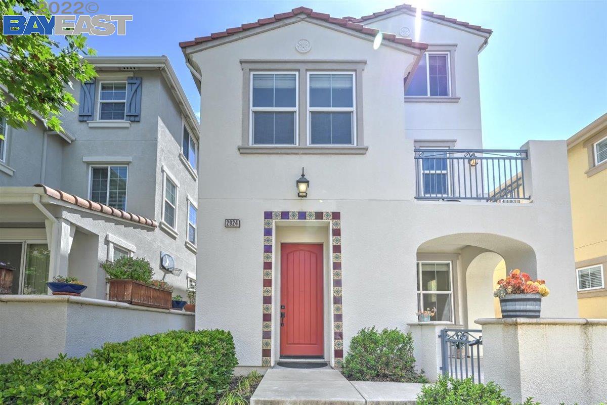 2924 Sage Common Livermore, CA 94551 - Photo 1 of 1 a front view of a house with large windows and plants