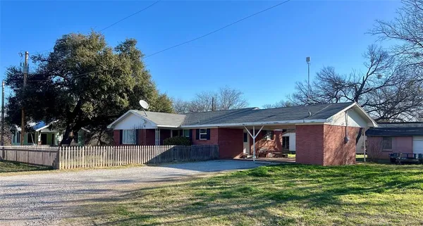 a view of a house with backyard porch and furniture