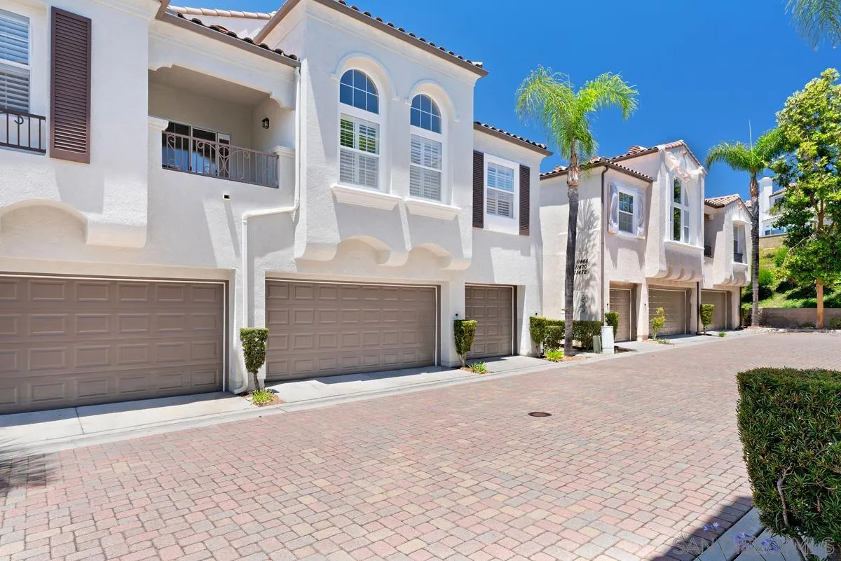 11456 Miro Circle San Diego, CA 92131 - Photo 2 of 34 a front view of a house with a yard and garage