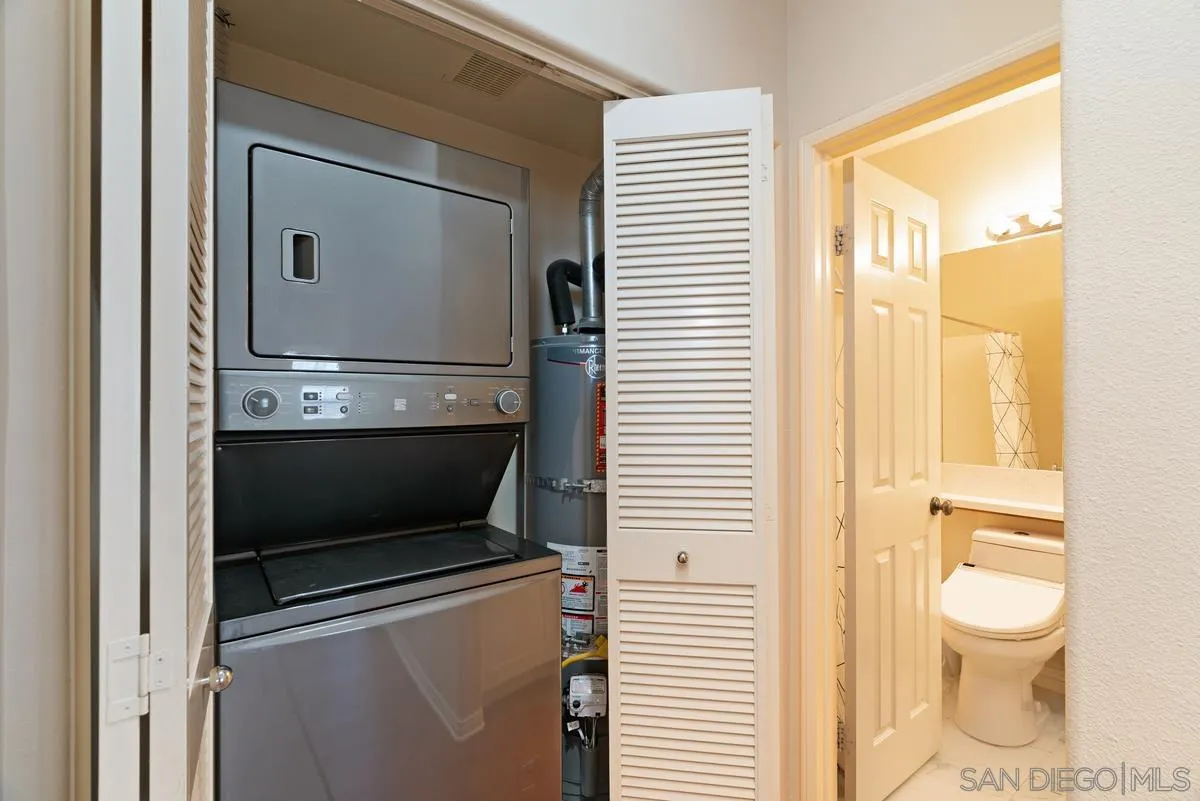 11456 Miro Circle San Diego, CA 92131 - Photo 26 of 34 a bathroom with a toilet a sink and a window