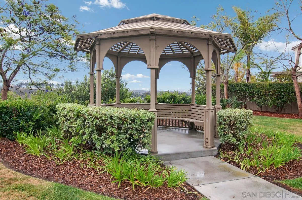 11456 Miro Circle San Diego, CA 92131 - Photo 29 of 34 a front view of a house with garden