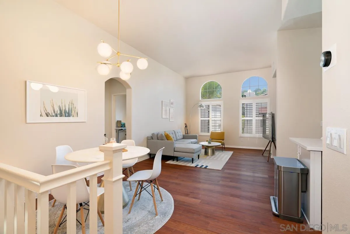 11456 Miro Circle San Diego, CA 92131 - Photo 6 of 34 a view of a livingroom with furniture wooden floor and a large window